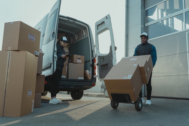 Two workers planning a delivery trip with a good multi stop route planner.