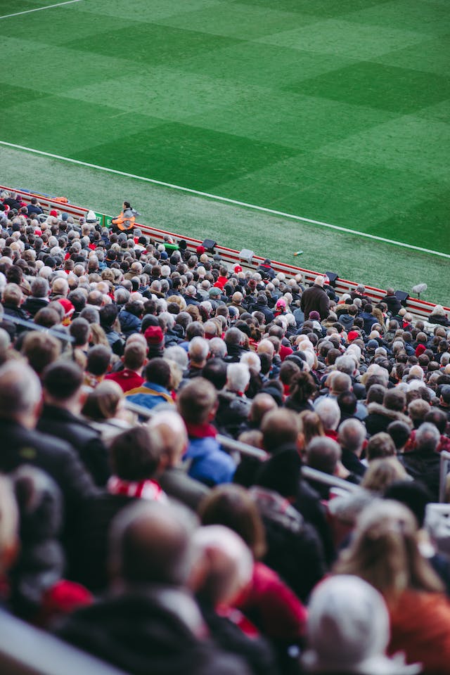 Thousands of supporters enjoying a sporting event at the world’s largest stadium.