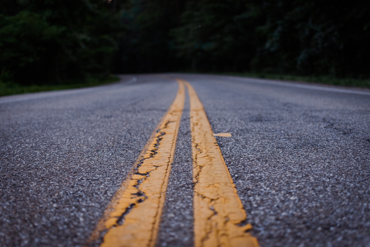Close view of a grey tarred road