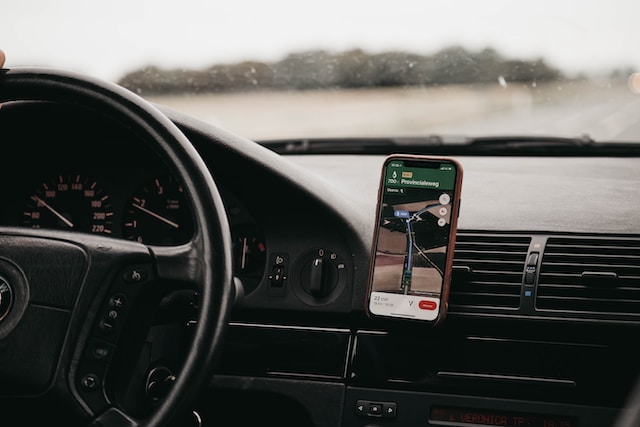 A delivery driver using Google Maps to find the route to the client’s destination.