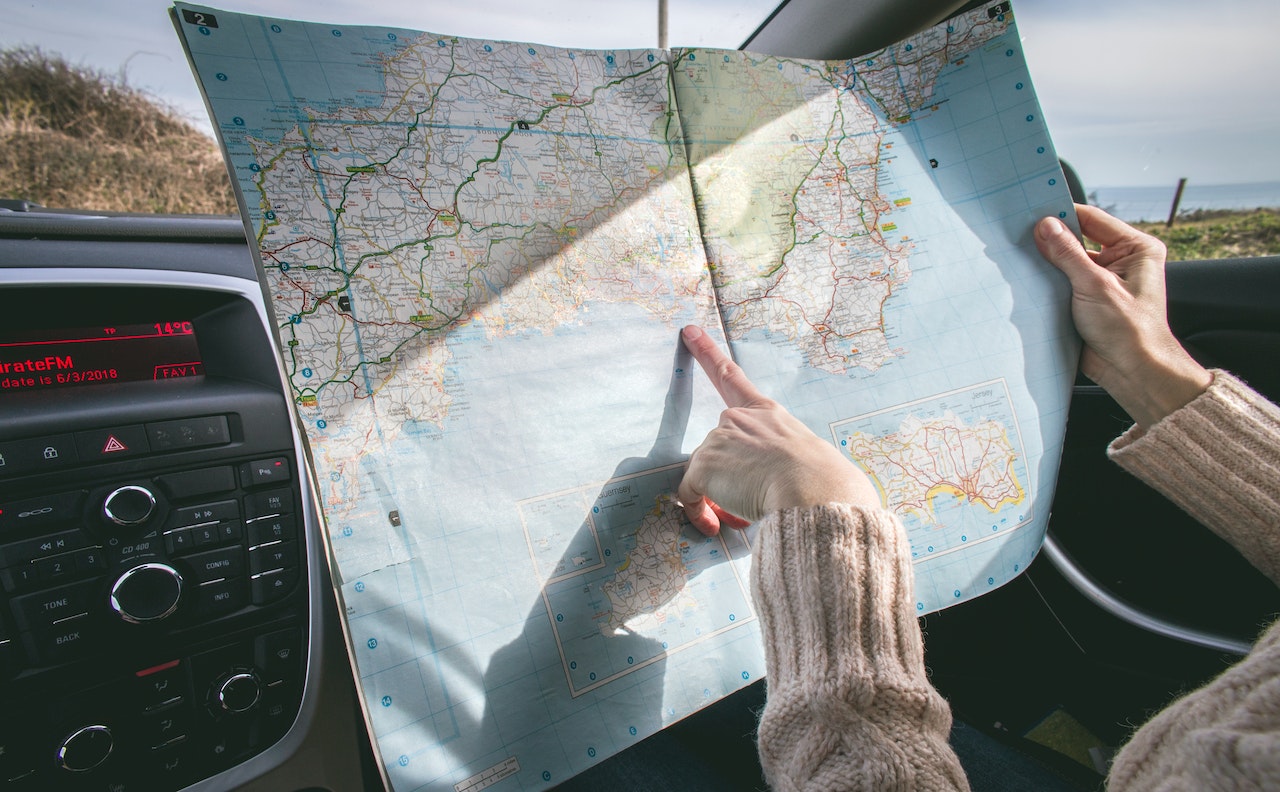 A user looking at a well-detailed reference map for navigation.