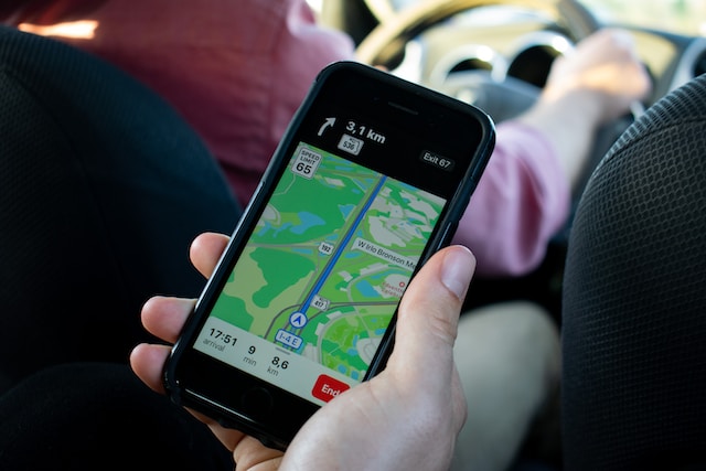 A user in public transit using a navigation app on his smartphone to navigate to work successfully.