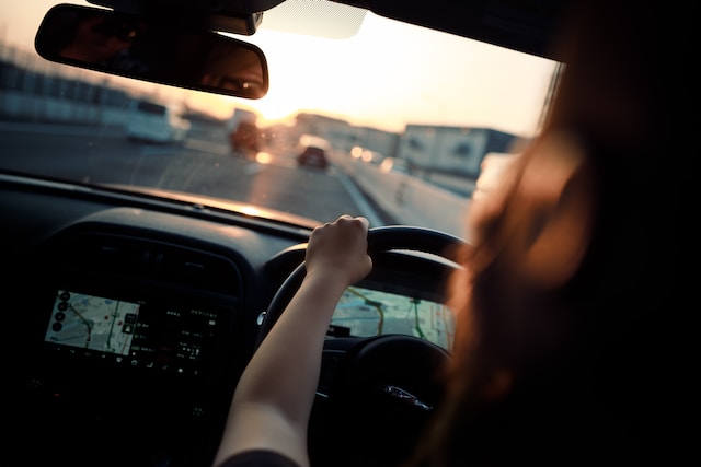 A lady enjoying her road trip with route planner apps.