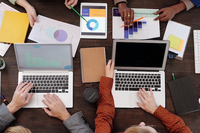 A team utilizing various data visualization software for their business.