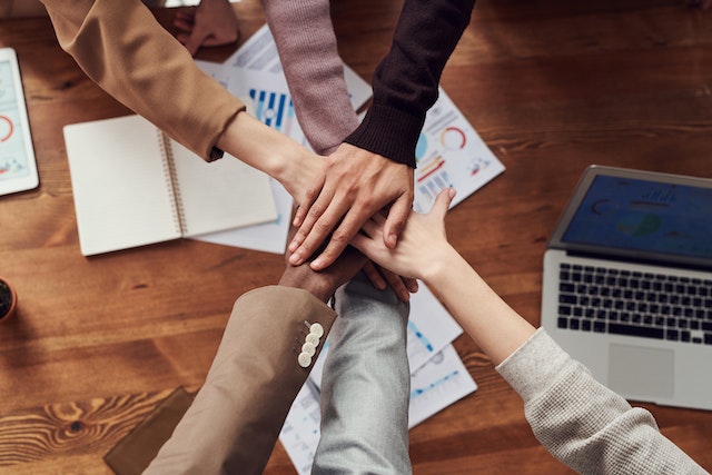 A group of people agreeing to a business partnership.