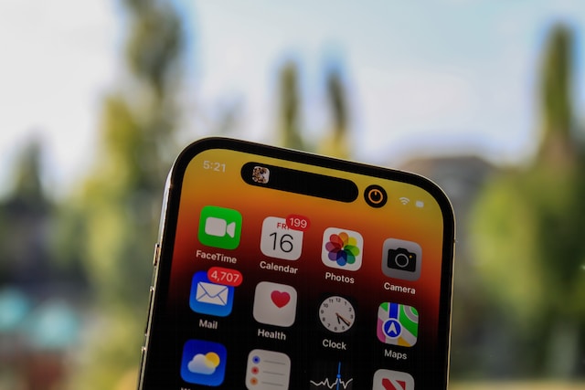 Apple Maps icon and other Apple app icons displayed on iPhone 14 pro max. 
