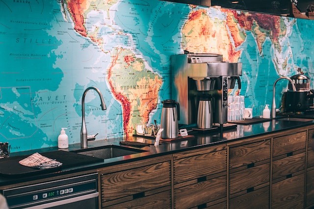 An easy map of the world placed behind office cabinets.